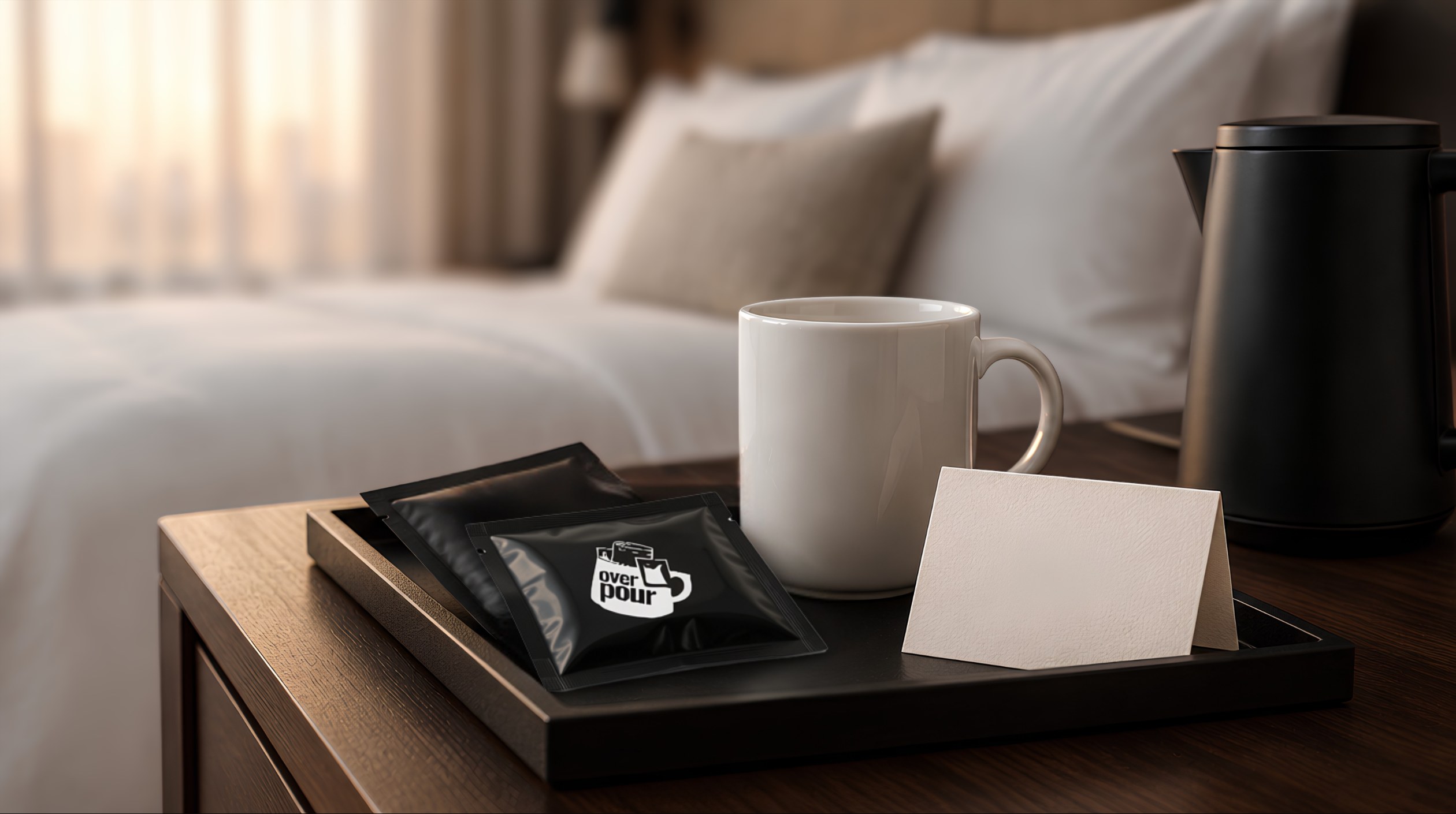 A hotel nightstand tray with two Overpour sachets, a white mug and a kettle